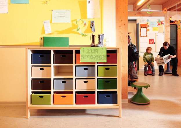 Half-cupboard for storing personal boxes.